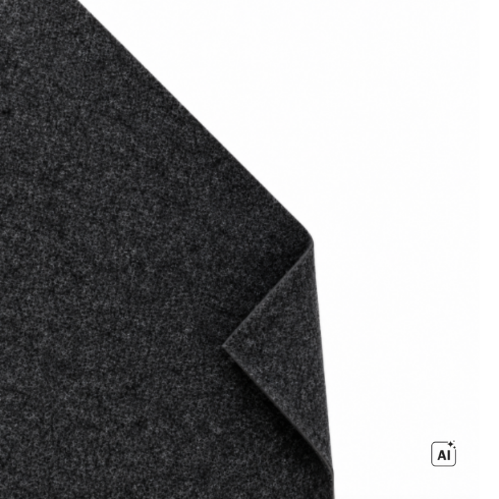 Carpet-Filz in Anthrazit mit umgeschlagener Ecke, Nahaufnahme der Oberfläche auf weißem Grund